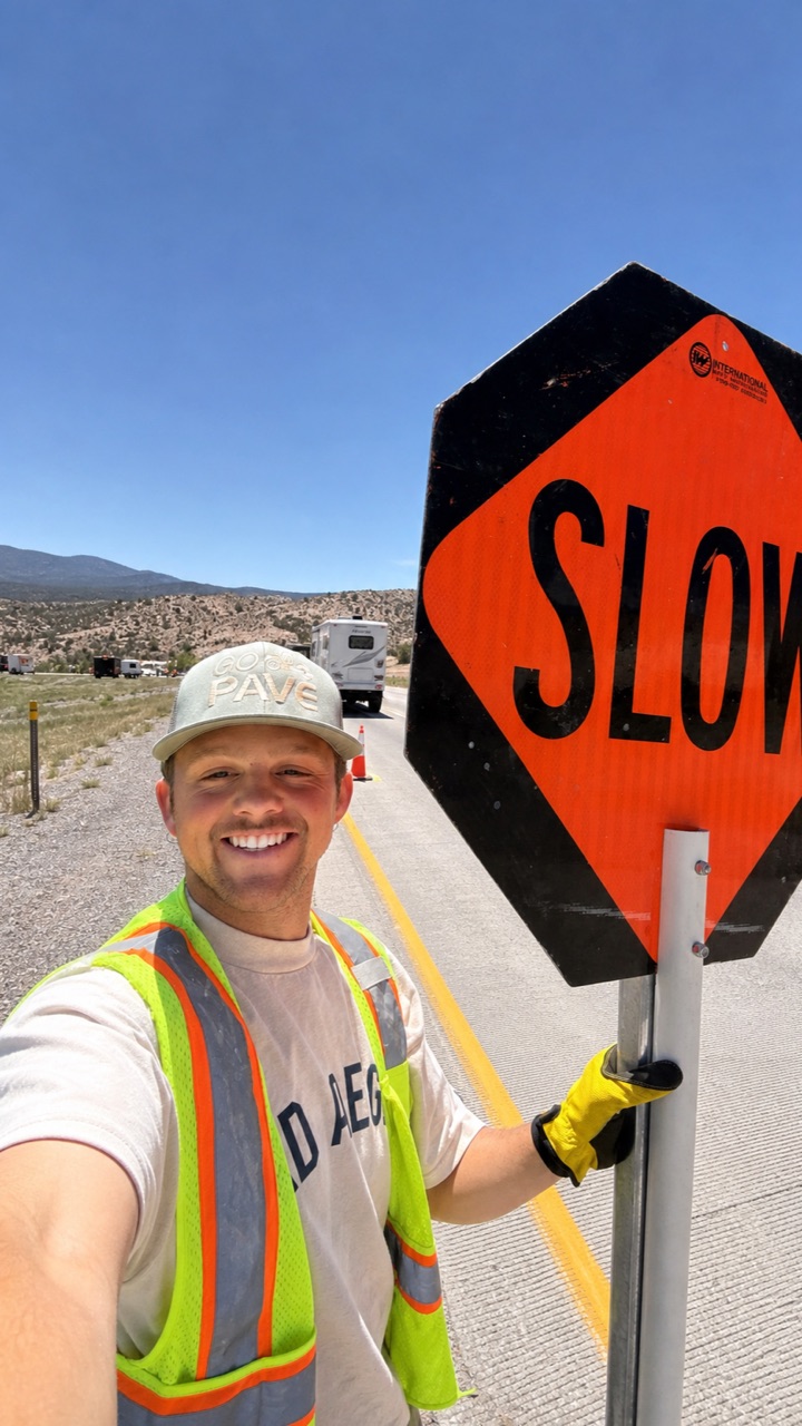 Luke wearing a safety vest on a striping job