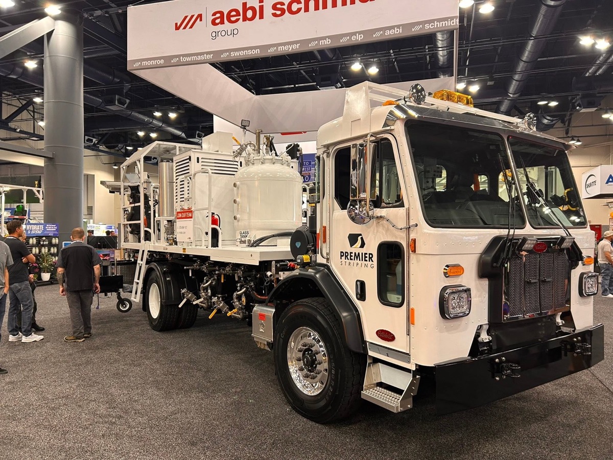 Premier Striping line-striping truck displayed at an industry show